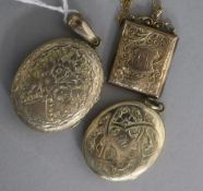 An early 20th century 9ct gold locket and 9ct gold chain and two other lockets.