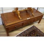 A low Chinese hardwood three drawer table, W.127cm