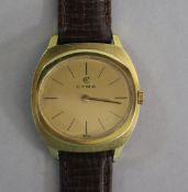 A gentleman's gold plated and steel Cyma manual wind wrist watch.