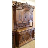 A carved oak Flemish cabinet, W.139cm