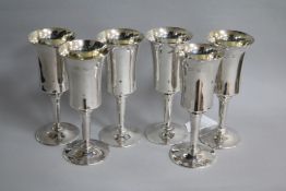 A set of six 1970's silver pedestal goblets by Toye, Kenning & Spencer, Birmingham, 1973, 16.6cm.