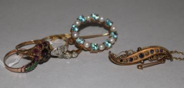 Two gold and diamond rings, one stamped 18ct, two other gold and gem set rings and two gold