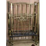 A pair of Edwardian brass single beds