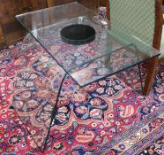A glass revolving table and a pair of metal and glass bedside tables, Table W.80cm Tables H.55.5cm