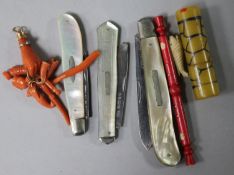 Three mother of pearl pen knives, a coral pendant, etc.