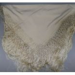 A 1920's fringed silk shawl in lacquered box