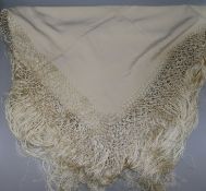 A 1920's fringed silk shawl in lacquered box