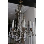 A 17th century style bronzed metal and glass chandelier, with ball drops, wired for electricity