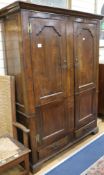 A small George III style mahogany wardrobe W.131cm