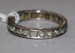 A platinum and diamond full eternity ring, size N.