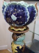 A Victorian pottery jardiniere and stand
