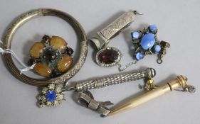 A Chinese rattan and white metal bangle, various hardstone brooches, paste jewellery, propelling