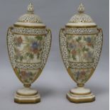 A pair of of Grainger Worcester lidded vases