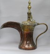 An Islamic copper and brass dallah