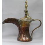 An Islamic copper and brass dallah