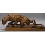 A French Art Deco carved model of a lioness