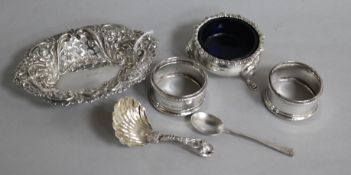 An Edwardian silver bon bon dish, a caddy spoon, two napkin rings and an Edwardian silver salt and