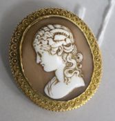 An Italian cameo brooch, profile of a young girl, with scrolled mount, 44mm.