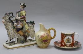 A Ginori figure, a Worcester cup and saucer and a jug