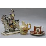 A Ginori figure, a Worcester cup and saucer and a jug