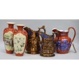 Two Victorian copper lustre jugs, a pair of vases and a jug