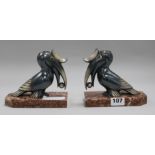 A pair of French toucan bookends, signed Franjou