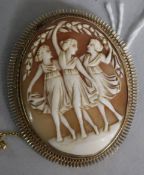 An Italian 9ct cameo brooch carved with the Three Graces, 59mm.