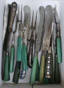 A collection of Georgian cutlery, green stained ivory and silver