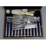 A quantity of plated fish knives and forks and ivory dressing table items, etc.