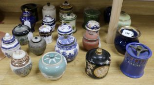 A collection of small ceramic tobacco and other jars and covers, including Carlton examples (23)