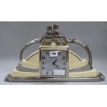 An Art Deco French pottery mantel clock, decorated with pheasants