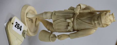 A Japanese carved ivory figure and dance card