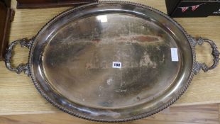 A circular silver plated tray