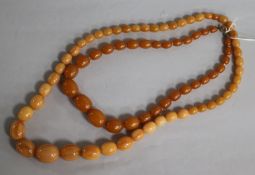 Two amber coloured necklaces.