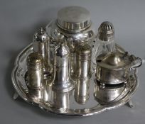 A silver toilet jar and cover, a silver mustard, a pair of Scottish silver peppers, a plated