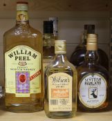 Seven assorted bottles of whisky and bourbon: Wilsons of New Zealand half bottle, Williams Peel