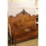 A French walnut bedstead, W.152cm