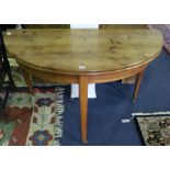 A French fruitwood demi lune fold out dining table, 124cm.