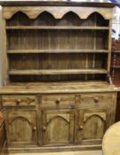 A stained pine dresser W.153cm