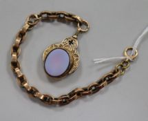 An early 20th century 10ct gold, bloodstone and carnelian spinning fob seal on a yellow metal