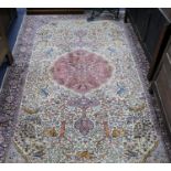 A Persian 'Tree of life' ivory ground carpet W.275 x 180cm