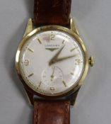 A gentleman's 14ct gold Longines manual wind wrist watch.