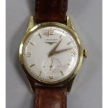 A gentleman's 14ct gold Longines manual wind wrist watch.