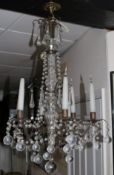 A 17th century style bronzed metal and glass chandelier, with ball drops, wired for electricity