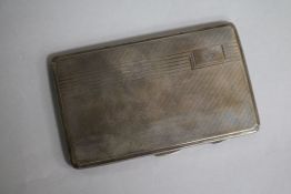 A 1930's Art Deco engine turned silver cigarette case, engraved with masonic "bee", 14cm.