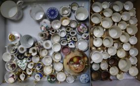 A large collection of miniature porcelain mugs and other ceramics including Royal Worcester, Royal