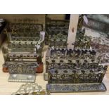 A collection of brass pipe racks, various (Q)