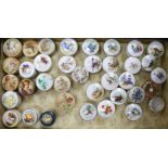 A collection of Royal Worcester and other rouge pots and covers, three fruit painted