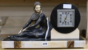 An Art Deco spelter and marble figural mantel clock