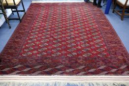 A Turkish red ground carpet 340 x 250cm